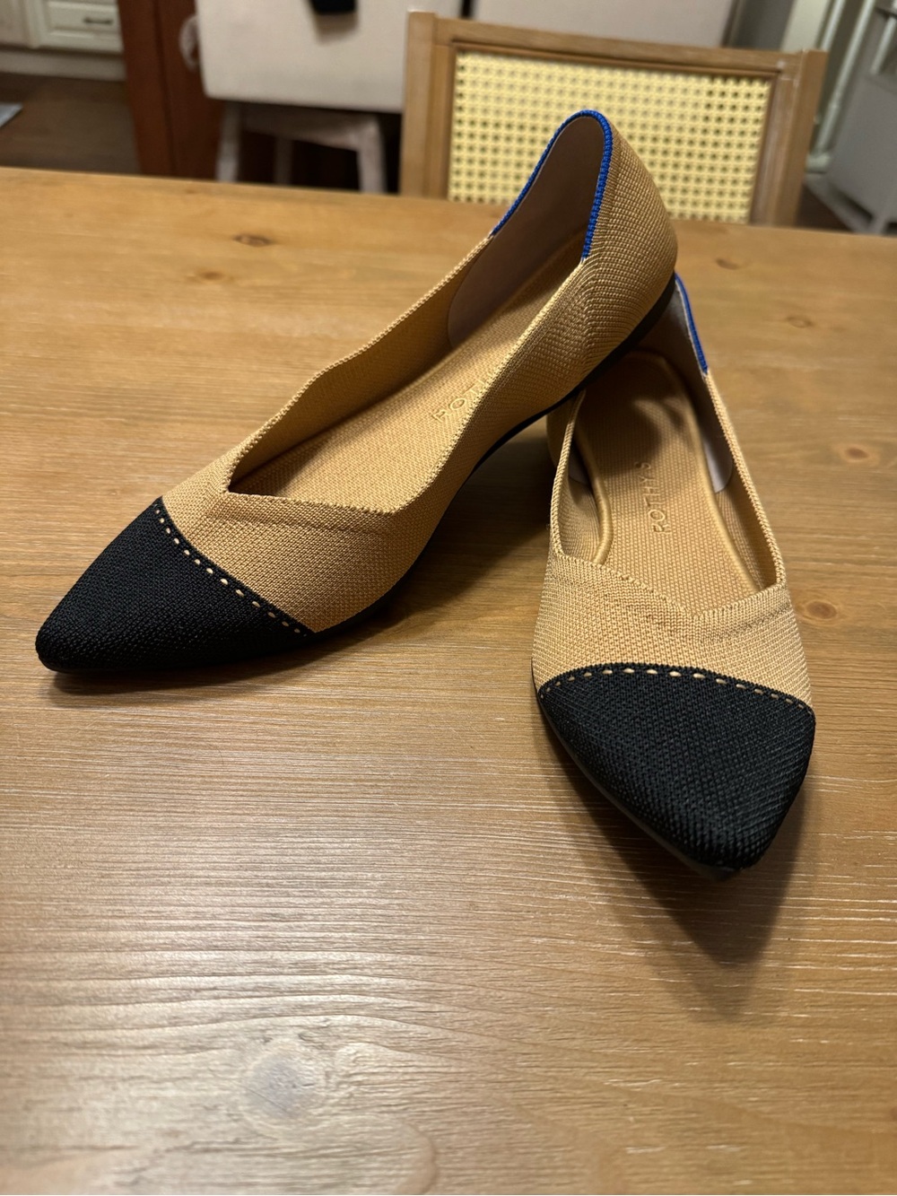 Rothy's Two-Tone Pointed Toe Flats in Tan and Black with Blue Trim